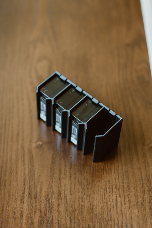 Holder with three batteries, angled view
