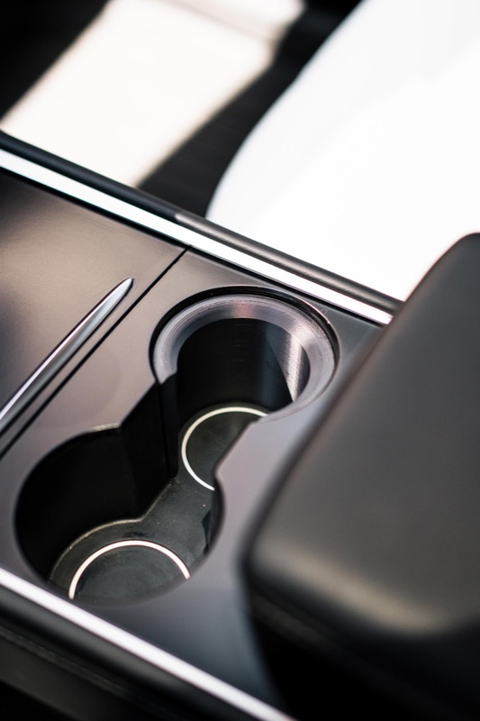 The black insert sitting in the cup holder, empty
